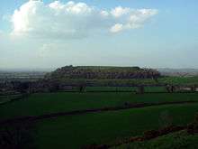 Flat topped hill standing out from the surrounding countryside.