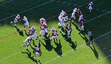 American football players during a play.