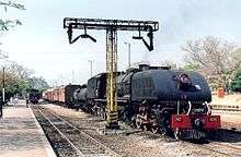 15th class No. 406 Ikolo (Hornbill) with a passenger train at Victoria Falls, 1997.