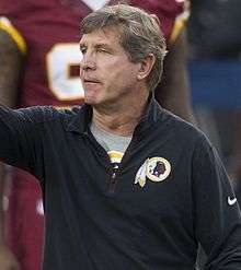 Color photograph of Callahan wearing a Washington Redskins jacket