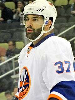 Brain Strait standing on the ice with his helmet on.