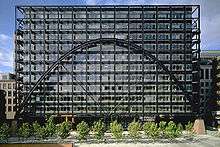 Front view of the Broadgate Exchange House clearly showing the parabolic arch impose dover a grid of windows