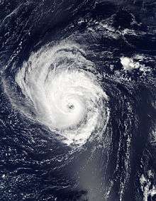 A visible satellite image depicting an organized and strengthing hurricane over the central Atlantic on September 15.