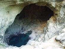 A rocky pool in a deep hollow