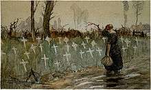 A woman in a long dress stands at a roadside looking at a collection of thirty white cross grave markers, surrounded by grass, in a field beside the road.