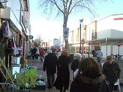 Busy urban street with storefronts