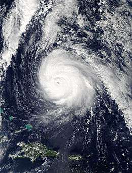 A visible satellite image of a well-organized hurricane shortly past its peak intensity on October 16.