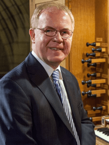 Portrait of John Scott with Organ at St Thomas Church in New York, NY.