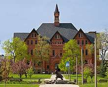 Looking south on the campus of Montana State University in Bozeman, Montana, USA. Montana Hall sits in the background with Alumni Plaza and a bronze sculpture of Spirit the Bobcat in the foreground. Photo by Kelly Gorham