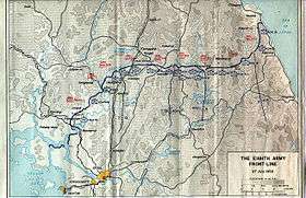 A map showing the front-line and the battle positions of the protagonists, extending from the south-west coast on the left of the map to the north-east coast on the right, across a peninsula. To the north of the line red icons denote the dispositions of the Chinese forces, while to the south blue icons denote those of the UN. In the bottom left of the map is the city of Seoul, which is depicted to the south.