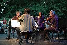 Kronos Quartet performing outdoors