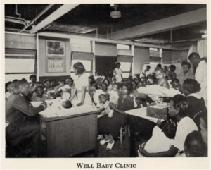 A room filled with young children sitting at desks.