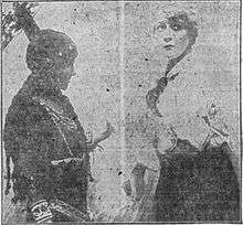 Two women, costumed as a Native American and a farmer's wife