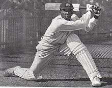 A cricketer batting