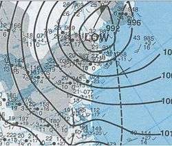 Map of the northeastern United States, showing a more tightly-wound storm. The low center is situated over northern New England, although precipitation extends well to the west.