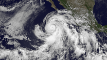 A visible satellite image depicting sprawling Hurricane Cosme on June 25.