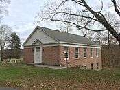 View of front and side elevations of a brick building