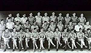 Portrait of military personnel standing or seated in three rows