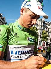 Peter Sagan wearing a green cycling jersey.