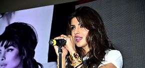 Priyanka Chopra singing on stage