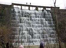 A photo showing a view of the front of Searsville Dam in 2013