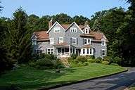 A shingled three-story house