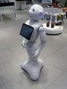 The robot Pepper standing in a retail environment