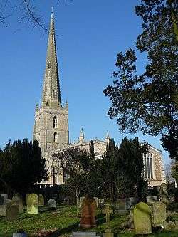 A church with a tall slim steeple