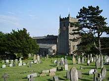 A church with a battlemented west tower