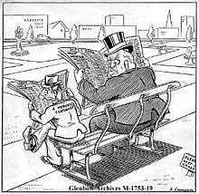 A cartoon of two men sitting on a park bench reading the "help wanted" sections of newspapers. The one on the right is heavyset, wearing a top hat and glasses, and is looking angrily towards the one on the left. The one on the left is small and thin, and wearing a fedora. He is labelled "A moronic cartoonist".