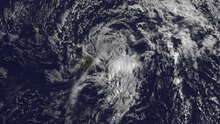 A visible satellite image depicting a degenerating tropical cyclone offshore Hawaii on July 29.