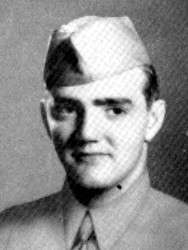 Portrait of a white man in a military uniform looking off to his left and smiling.