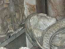 Damaged alabaster effigy of woman on a tomb