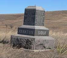 Stone monument on grassland hills