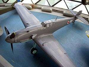 a colour photograph of an aircraft in a museum